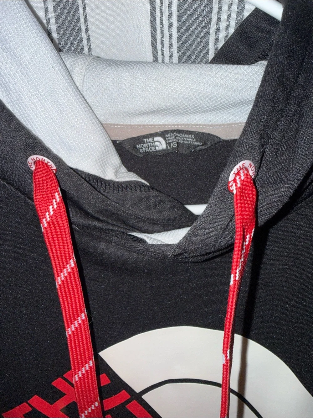The North Face Black Hoodie with Red Logo and White Arch